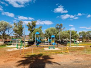 hard barricade with a-frame legs in front of playground in Paraburdoo